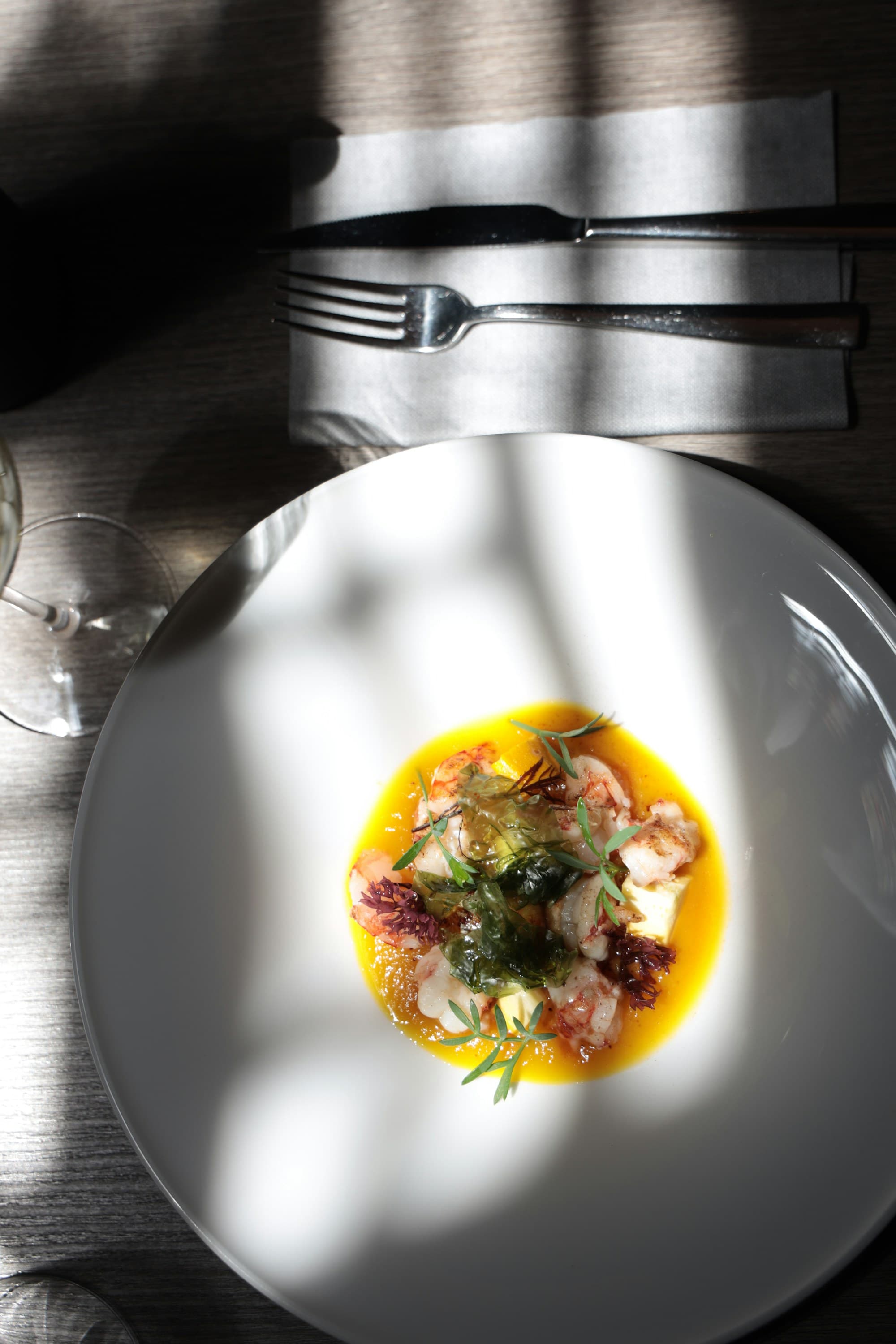 Elegant plated restaurant dish in natural window light