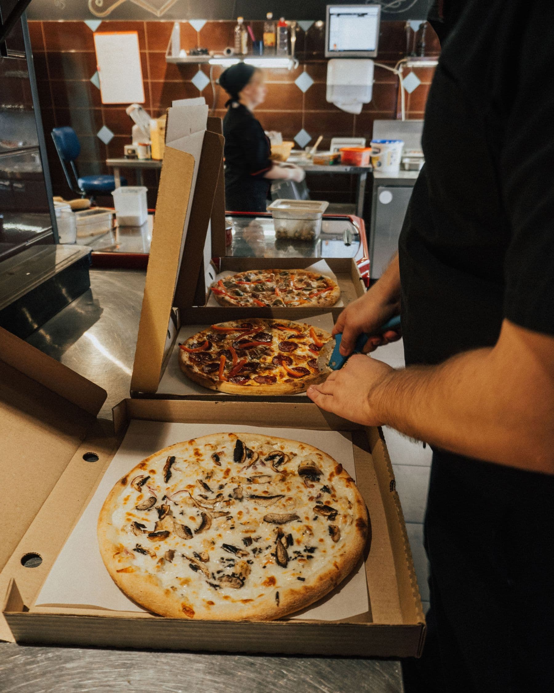 Restaurant team preparing direct orders for pickup