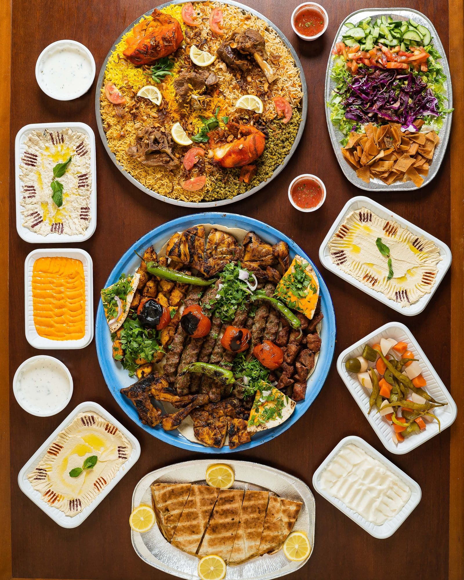 Overhead view of a restaurant table filled with prepared dishes